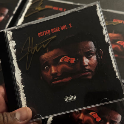 Close-up of a music album cover with a person's face and text on it.